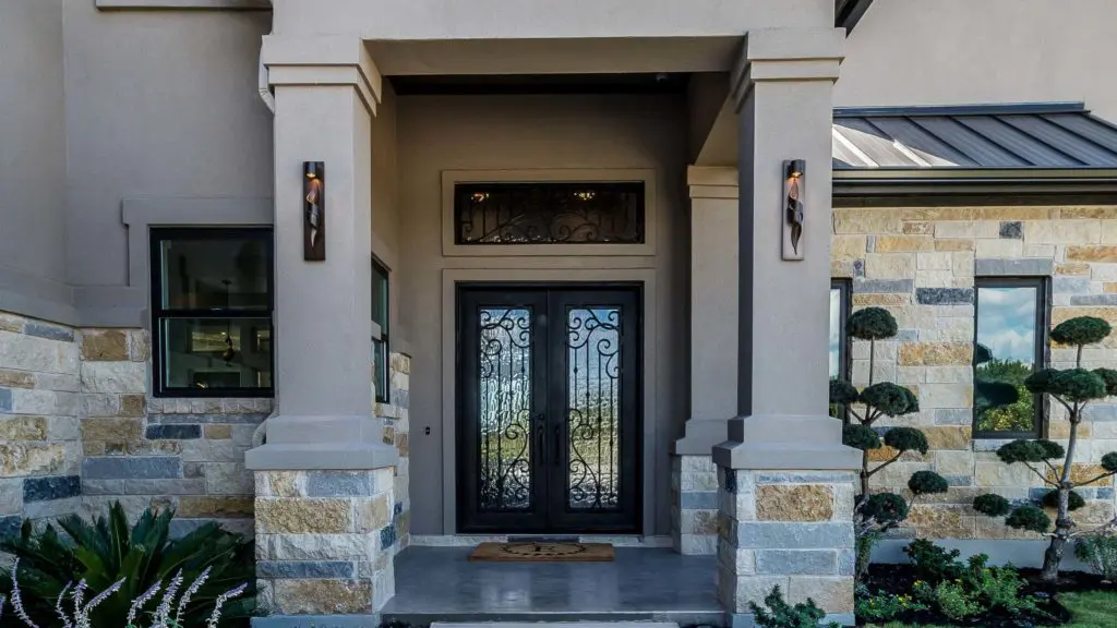 Entrance of a house with stucco exterior