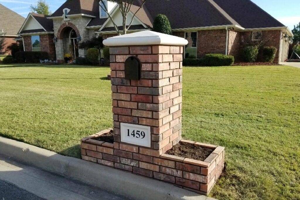 Custom brick mailbox built with planters and address plaque